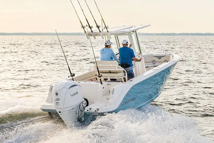 Slide: The Image of Manufacturer Provided Image: 2026 Sailfish 232 CC boat cruising on open water with two passengers. - 1