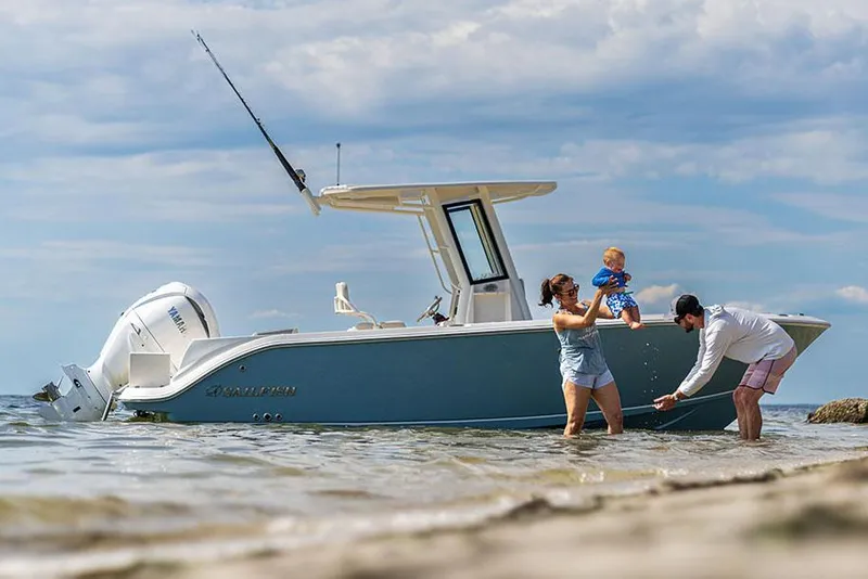 The Image of Manufacturer Provided Image: Family enjoying beach near 2026 Sailfish 232 CC boat on a sunny day. - 0