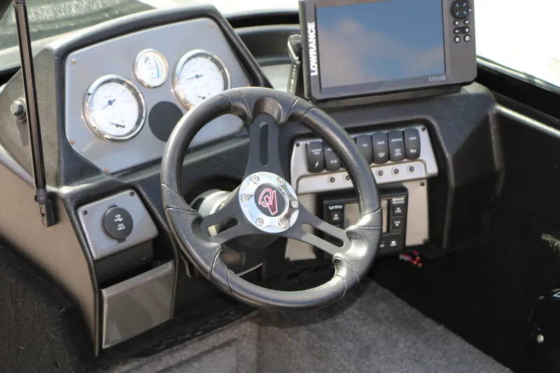 Slide: The Image of Dashboard of 2023 Alumacraft Competitor FSX 185 with steering wheel and navigation system. - 32