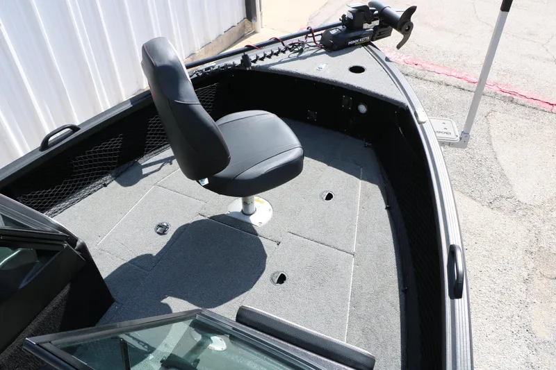Slide: The Image of 2023 Alumacraft Competitor FSX 185 boat interior with swivel seat and trolling motor. - 22