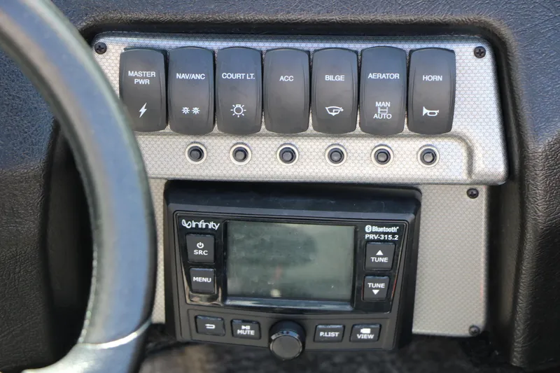 Slide: The Image of Control panel of 2023 Alumacraft Competitor FSX 185 boat with switches and Bluetooth stereo. - 33
