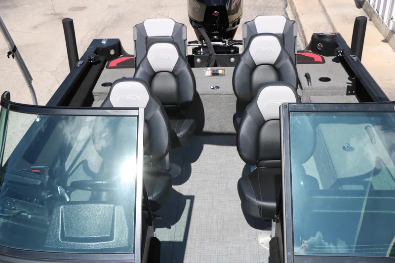 Slide: The Image of 2023 Alumacraft Competitor FSX 185 boat interior with four seats and windshield. - 24