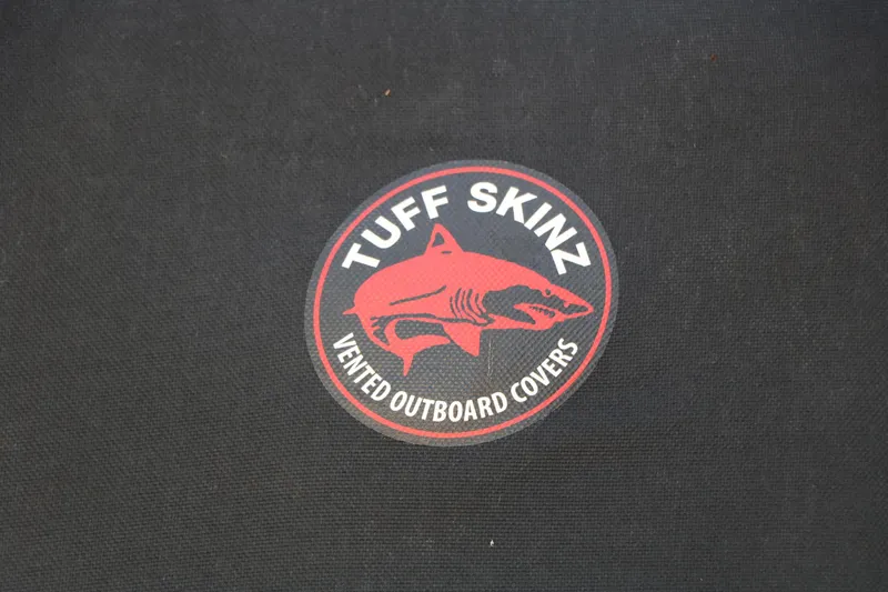 Slide: The Image of Tuff Skinz vented outboard covers logo on black fabric, 2023 Alumacraft Competitor FSX 185. - 49