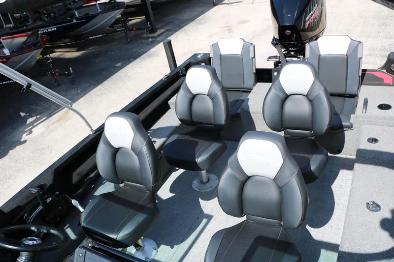Slide: The Image of 2023 Alumacraft Competitor FSX 185 boat interior with multiple cushioned seats. - 23