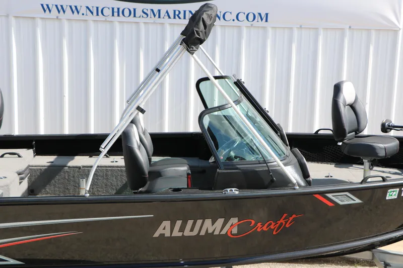 Slide: The Image of 2023 Alumacraft Competitor FSX 185 boat with sleek design and comfortable seating. - 12