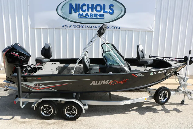 Slide: The Image of 2023 Alumacraft Competitor FSX 185 boat on trailer at Nichols Marine dealership. - 10