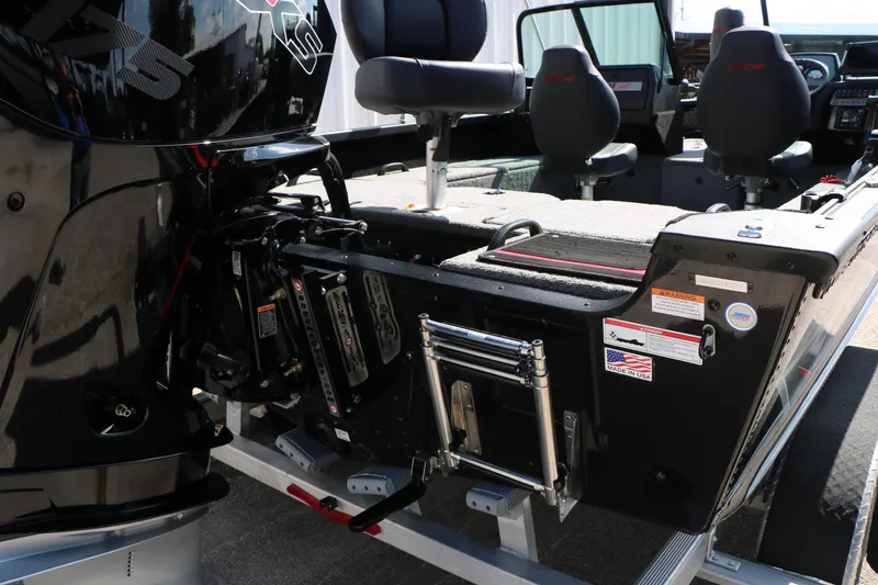 Slide: The Image of 2023 Alumacraft Competitor FSX 185 boat interior with seating and motor details. - 8