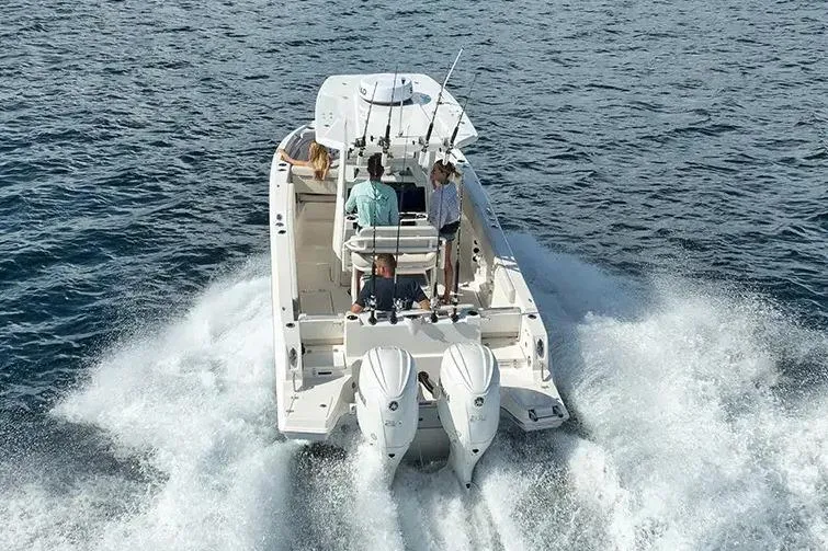 Slide: The Image of Manufacturer Provided Image: 2026 Sailfish 252 CC boat cruising on open water with passengers onboard. - 1