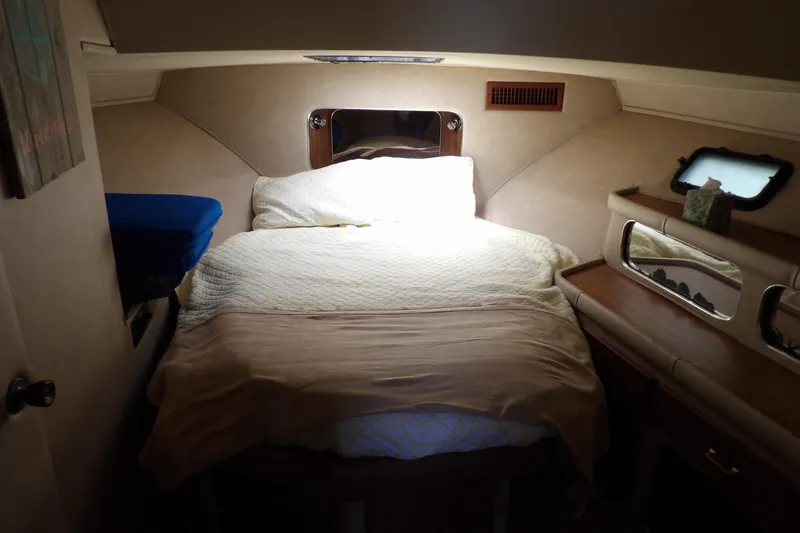 Slide: The Image of Cozy cabin interior of 1984 Chris-Craft 381 Catalina with bed and wooden furnishings. - 21