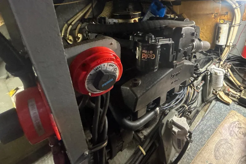 Slide: The Image of Engine compartment of 1984 Chris-Craft 381 Catalina with visible wiring and components. - 43