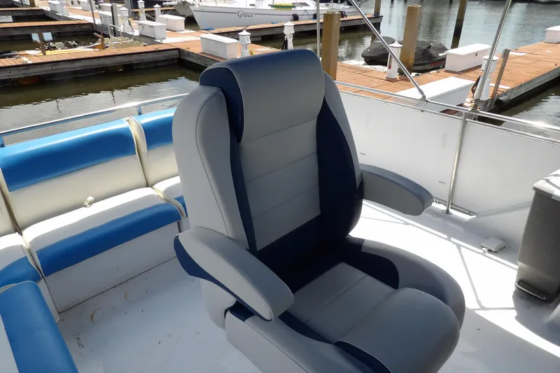 Slide: The Image of Captain's chair on 1984 Chris-Craft 381 Catalina yacht, docked at marina. - 15