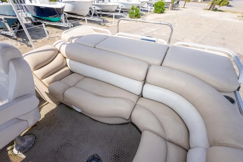 Slide: The Image of Luxurious seating on a 2007 Crest 111 XRS boat, showcasing beige upholstery. - 26