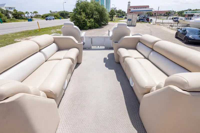 Slide: The Image of Spacious interior of 2007 Crest 111 XRS pontoon boat with beige seating. - 30