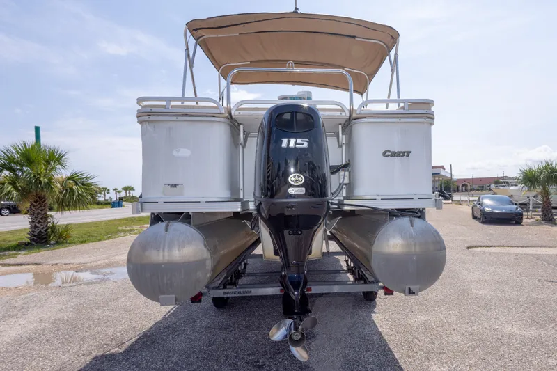 Slide: The Image of 2007 Crest 111 XRS pontoon boat with 115 HP motor, parked on a sunny day. - 11