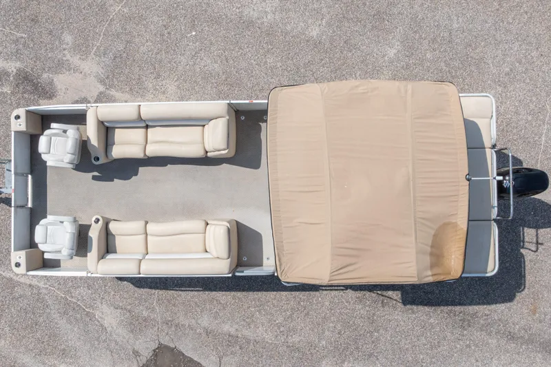 Slide: The Image of Aerial view of 2007 Crest 111 XRS pontoon boat with beige seating and canopy. - 6
