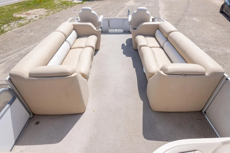 Slide: The Image of 2007 Crest 111 XRS pontoon boat with beige seating and spacious deck layout. - 27