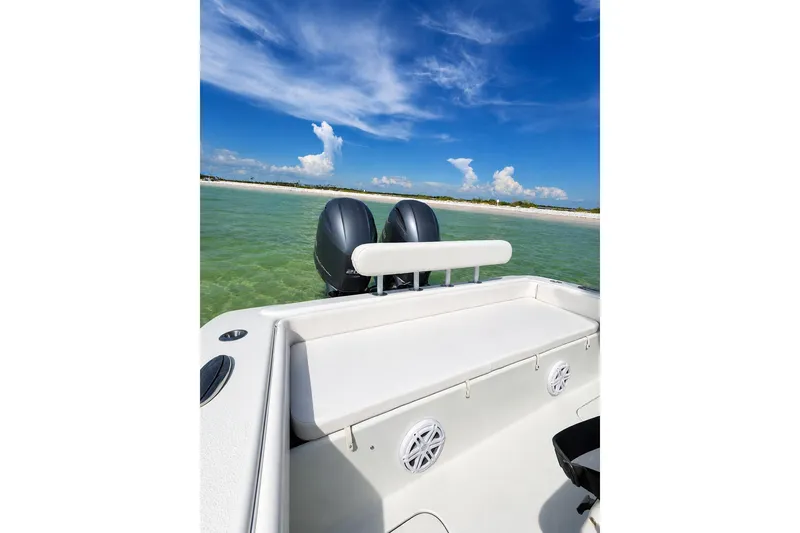 Slide: The Image of 2015 Yellowfin 26 Hybrid boat on clear water with blue sky background. - 12