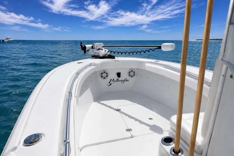 Slide: The Image of 2015 Yellowfin 26 Hybrid boat on open sea under clear blue sky. - 9