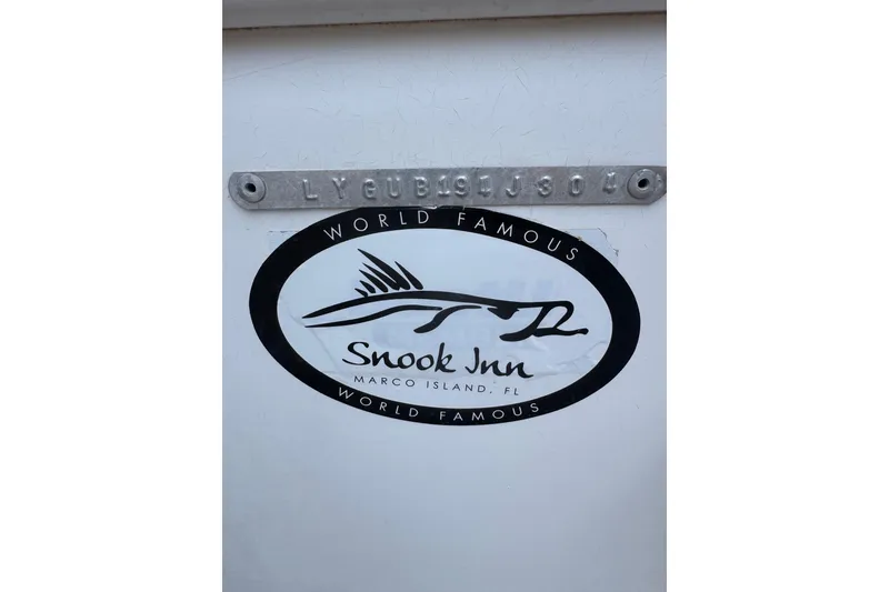 Slide: The Image of Sea Fox 225 Bay Fisher 2004 with Snook Inn logo, Marco Island, FL. - 36