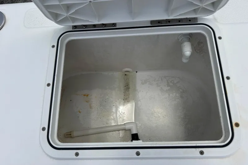 Slide: The Image of Open storage compartment on a 2004 Sea Fox 225 Bay Fisher boat. - 22