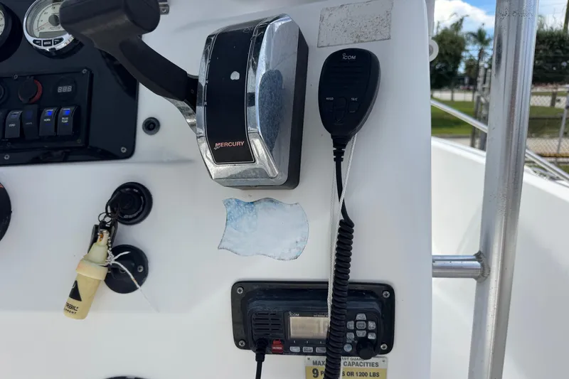 Slide: The Image of Control panel of a 2004 Sea Fox 225 Bay Fisher boat with Mercury throttle and radio. - 10