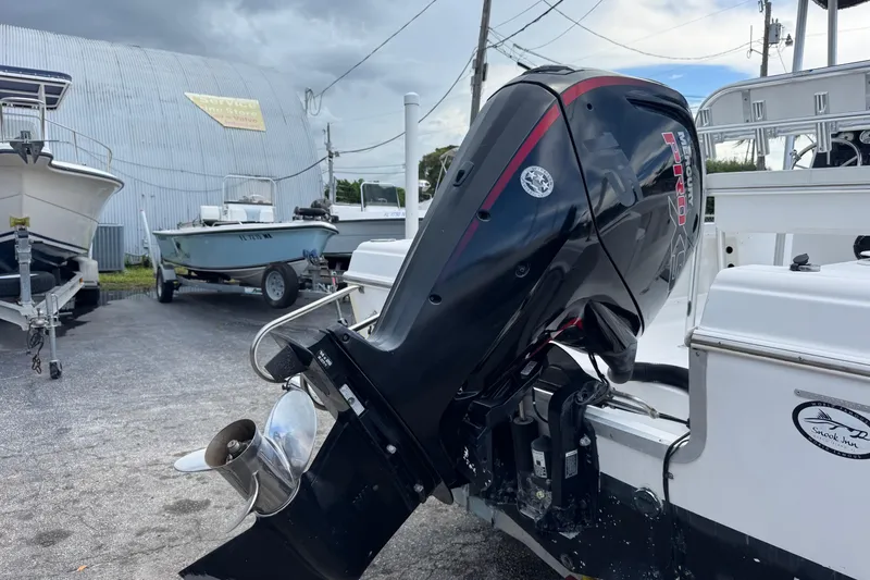 Slide: The Image of 2004 Sea Fox 225 Bay Fisher with Mercury Pro XS outboard motor in a boatyard. - 33