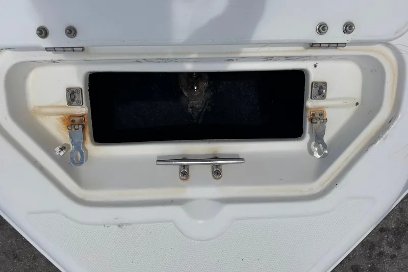 Slide: The Image of Open storage compartment on a 2004 Sea Fox 225 Bay Fisher boat. - 18