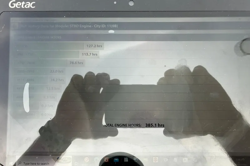 Slide: The Image of Getac device displaying engine hours for 2004 Sea Fox 225 Bay Fisher. - 39