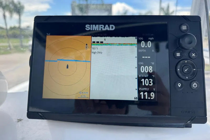 Slide: The Image of Simrad marine GPS display on 2004 Sea Fox 225 Bay Fisher boat, showing navigation data. - 9