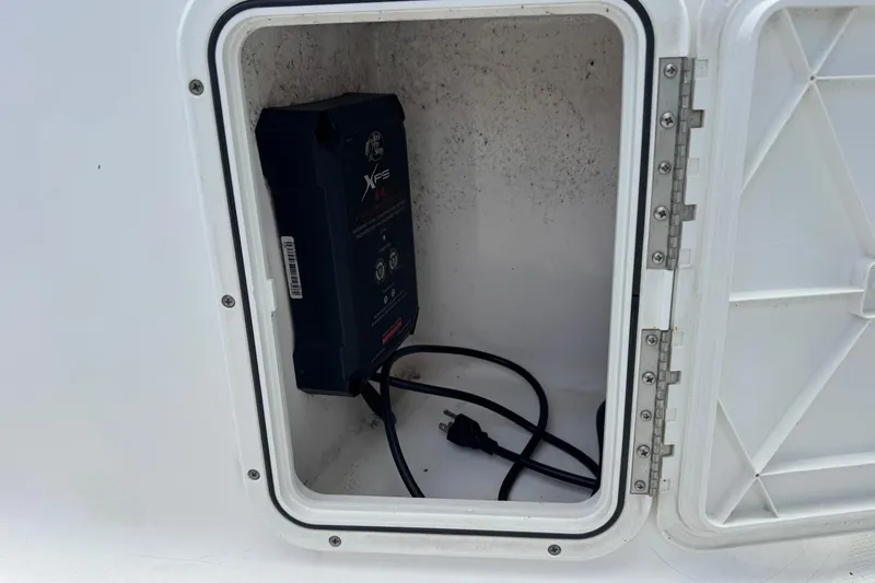 Slide: The Image of Storage compartment on a 2004 Sea Fox 225 Bay Fisher boat with electrical equipment. - 23
