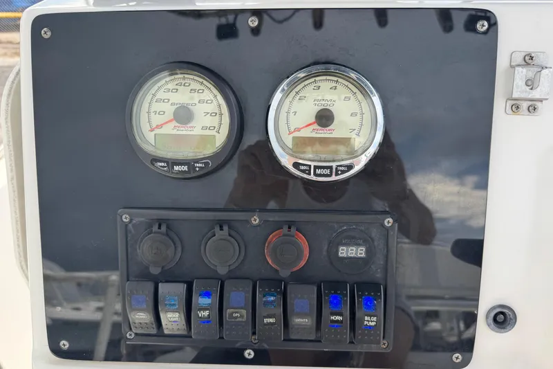 Slide: The Image of Dashboard of a 2004 Sea Fox 225 Bay Fisher boat with gauges and switches. - 7