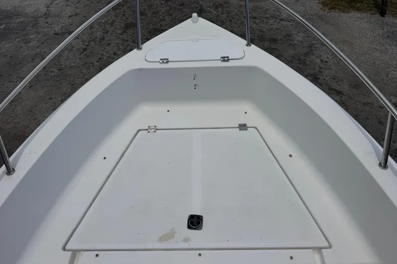 Slide: The Image of Bow area of a 2004 Sea Fox 225 Bay Fisher boat, featuring storage compartments. - 17
