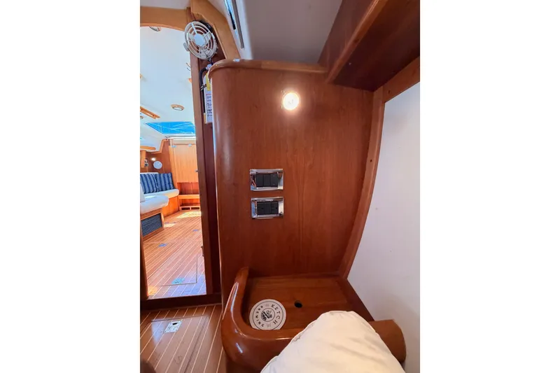 Slide: The Image of Interior of 2007 Saga 409 yacht with wooden paneling and seating area. - 83