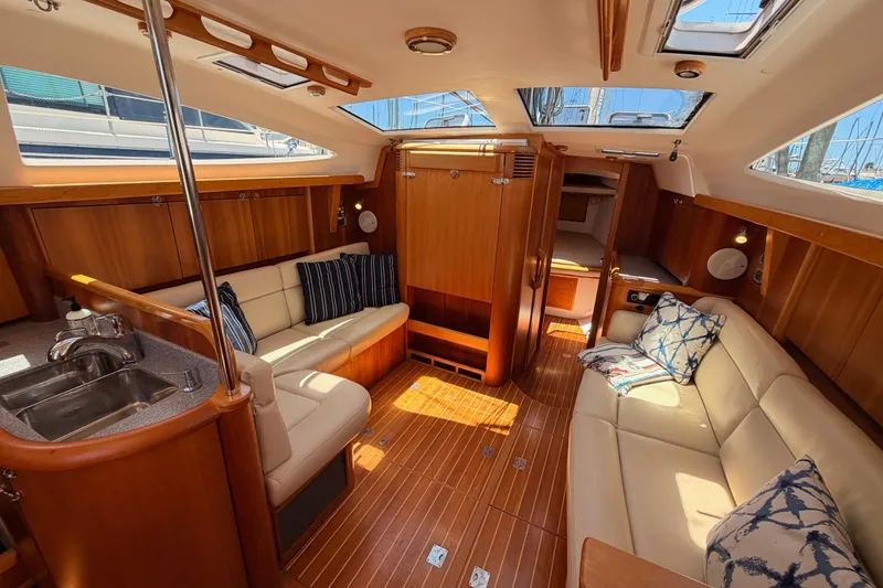 Slide: The Image of Luxurious interior of 2007 Saga 409 yacht with elegant wood finish and plush seating. - 85