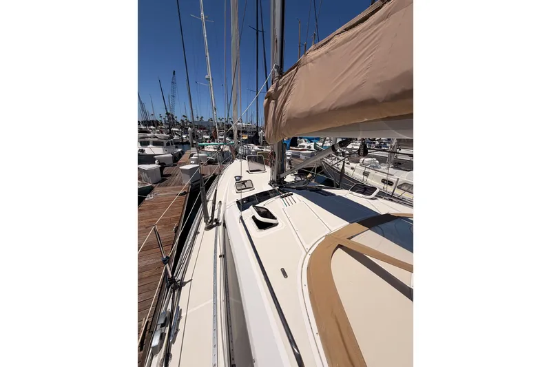 Slide: The Image of Sailboat docked at marina, Saga 409 model, 2007, with clear blue sky. - 18