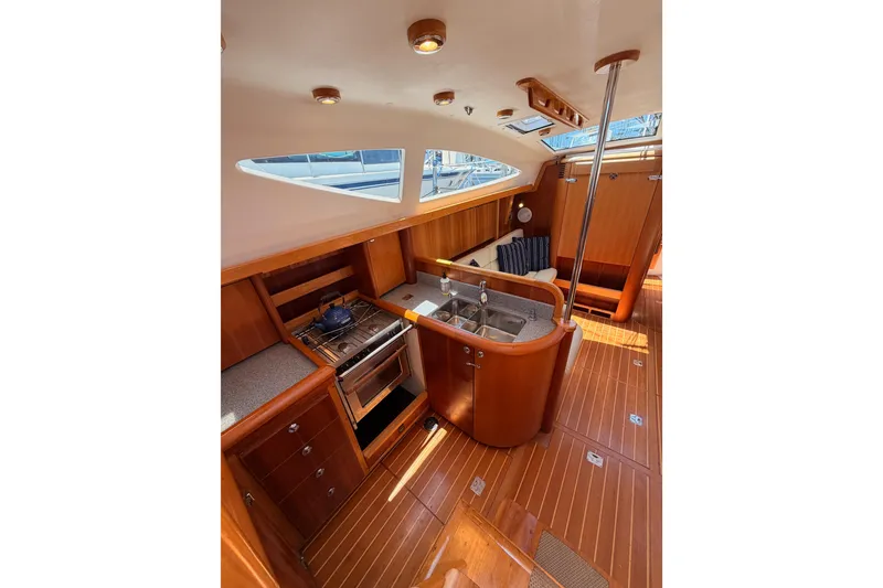 Slide: The Image of Luxurious 2007 Saga 409 yacht interior with modern kitchen and wooden finishes. - 58