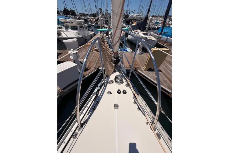 Slide: The Image of Bow view of a 2007 Saga 409 sailboat docked at a marina. - 21