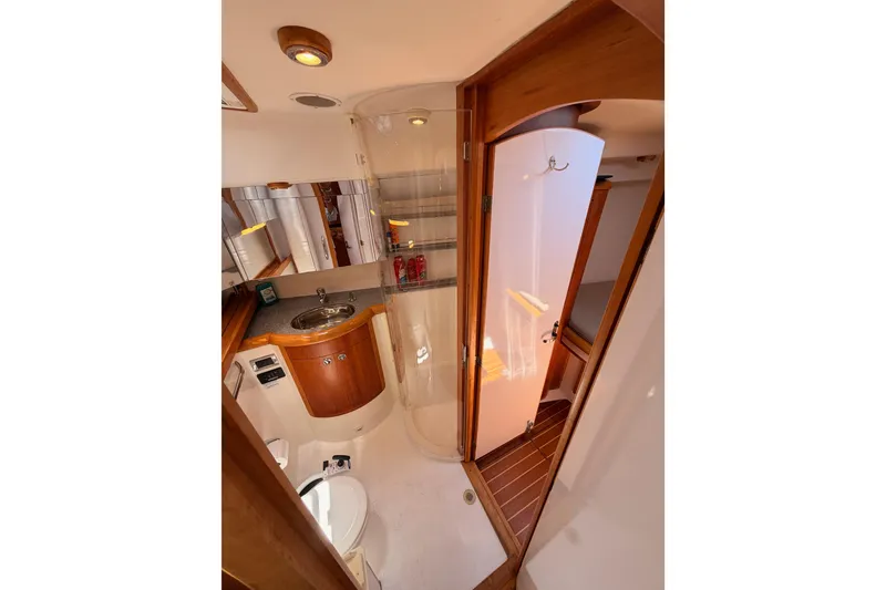 Slide: The Image of Luxurious 2007 Saga 409 yacht bathroom with wood accents and modern fixtures. - 97