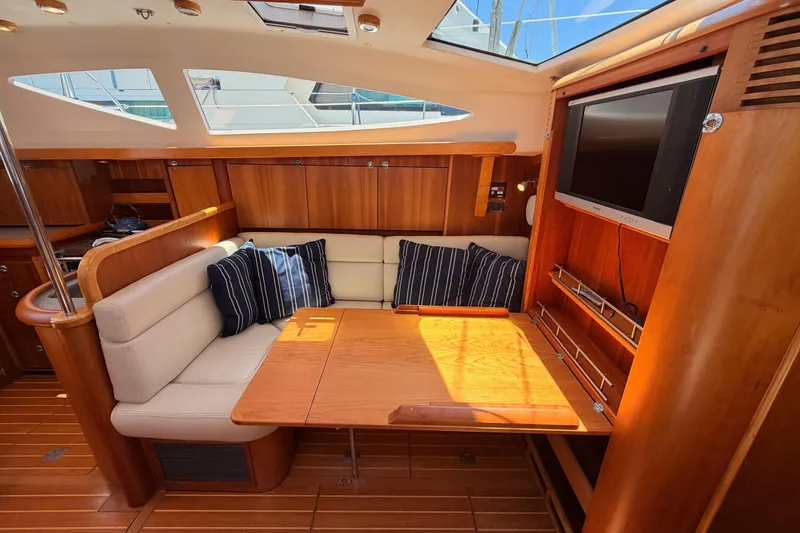 Slide: The Image of Luxurious 2007 Saga 409 yacht interior with wooden furnishings and cozy seating area. - 113