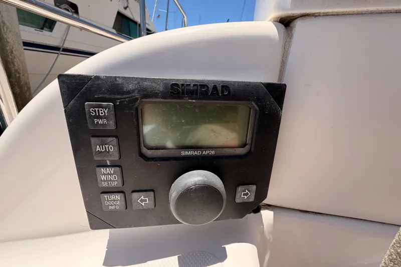 Slide: The Image of Simrad AP26 autopilot control on 2007 Saga 409 boat dashboard. - 43