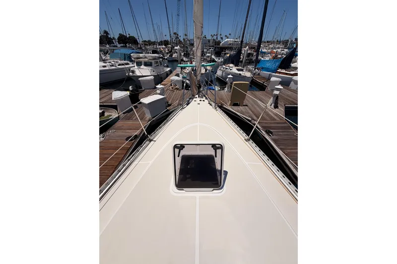 Slide: The Image of 2007 Saga 409 sailboat deck view in marina with surrounding boats. - 20