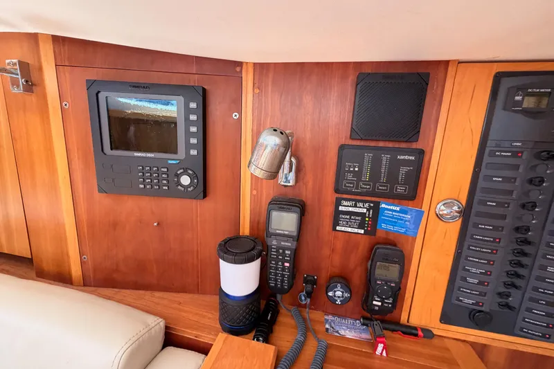 Slide: The Image of Control panel of a 2007 Saga 409 boat with navigation and communication equipment. - 74