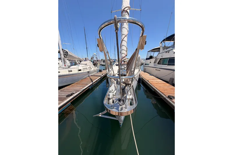 Slide: The Image of Front view of a 2007 Saga 409 sailboat docked at a marina. - 8