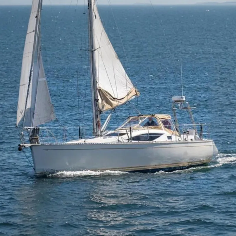 The Image of Sailboat on the water with white sails and blue sea. - 0