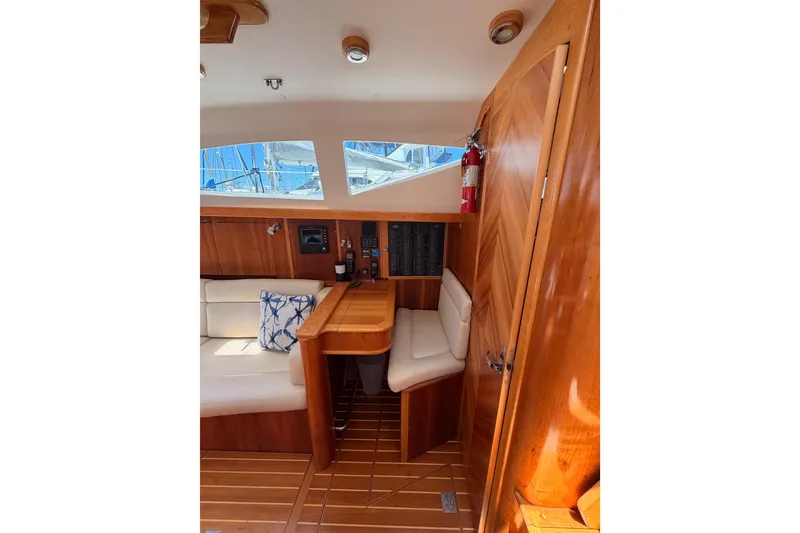 Slide: The Image of Interior of 2007 Saga 409 sailboat with wooden furnishings and seating area. - 73