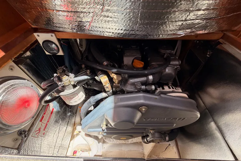 Slide: The Image of Engine compartment of a 2007 Saga 409 boat, showcasing mechanical components and insulation. - 116