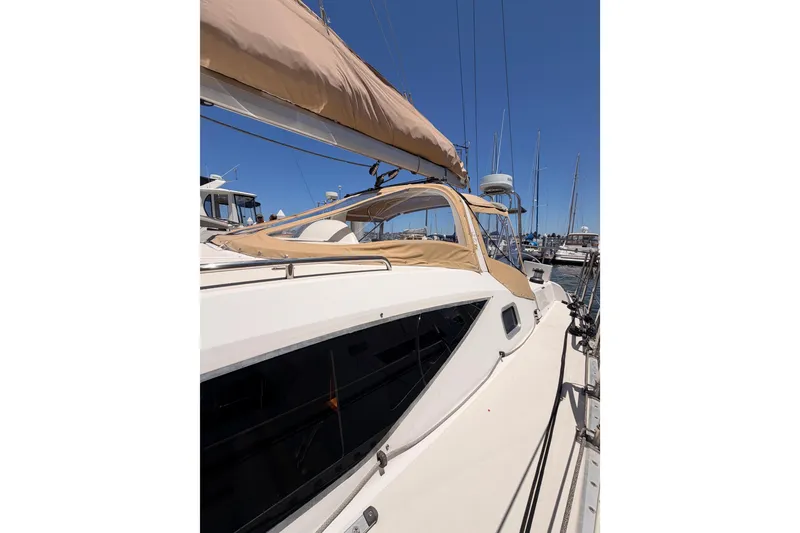 Slide: The Image of Sailing yacht Saga 409, 2007 model, docked at marina under clear blue sky. - 13