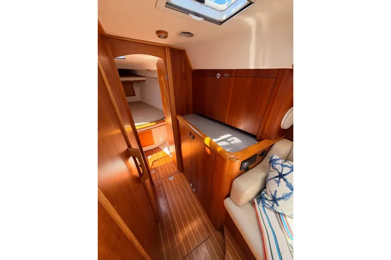 Slide: The Image of Interior of 2007 Saga 409 boat with wooden finish and cozy cabin space. - 94