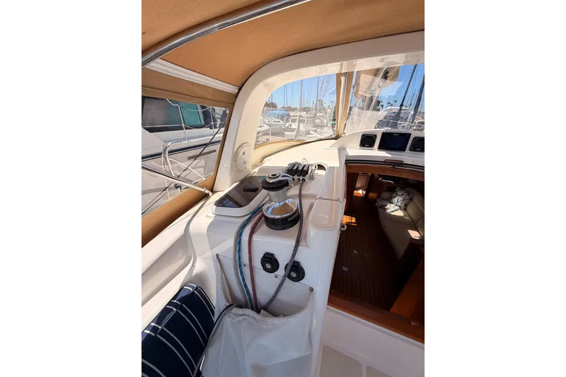 Slide: The Image of Cockpit view of 2007 Saga 409 sailboat, showcasing helm and interior cabin entrance. - 54