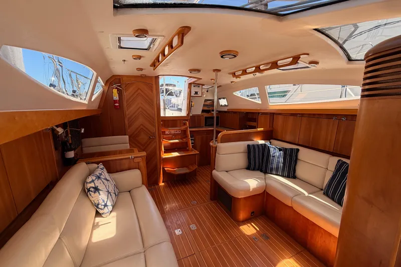 Slide: The Image of Luxurious 2007 Saga 409 yacht interior with elegant wood finish and plush seating. - 109